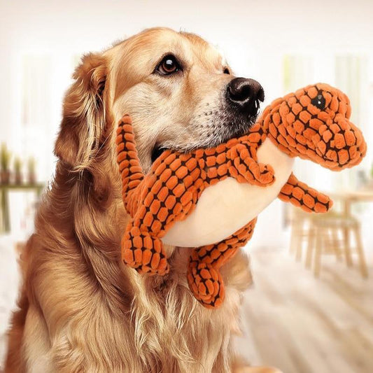 Golden retriever holding Belinana dinosaur dog toy for large breeds plush chew toy